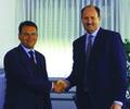 Derrick Mulligan signing the sale of shares and exclusive distributor agreements in Detmold, Germany with the Executive Board Chairman of Weidmüller, Thomas Hagen